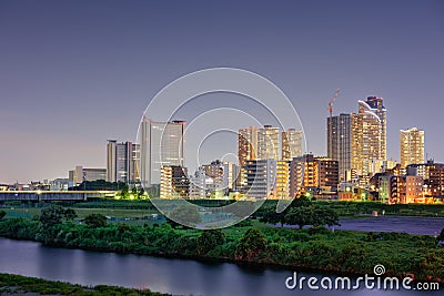 Kawasaki, Japan skyline on the Tamagawa River Stock Photo