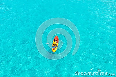 Kayak boat turquoise blue water sea, sunny day. Concept travel. Aerial top view Stock Photo