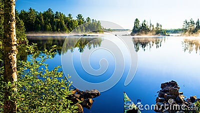 Kayak, morning mist, crescent lake Stock Photo