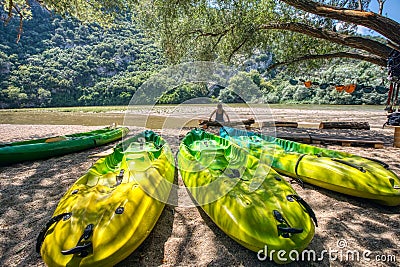 Kayak parked on the shore of a beautiful beach of the river Nestos, on a sunny day, Greece Stock Photo