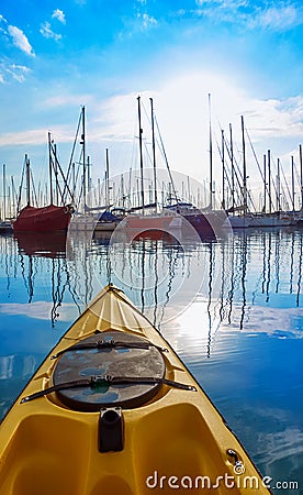 Kayak sailing in ocean sea at sunset Stock Photo