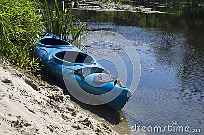 Kayak on the sandy shore Stock Photo