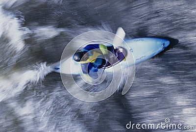 Kayaker Paddling Through Rapids Stock Photo