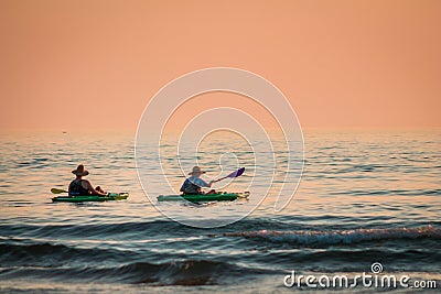 Kayakers on Lake Michigan at sunset Editorial Stock Photo