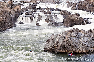 Kayakers navigating whitewater rapids at Great Falls Park, VA Editorial Stock Photo