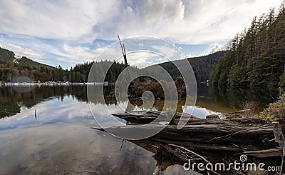 Kayaking in calm water with Canadian Mountain Landscape Background. Stock Photo