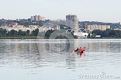Kayaking in the city river with red canoe, kayak boat paddling, process of canoeing Editorial Stock Photo
