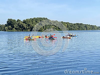 Kayaking in the city river with red canoe, kayak boat paddling, process of canoeing Editorial Stock Photo