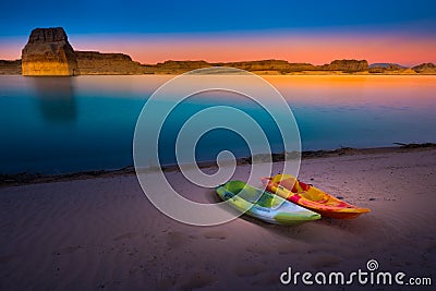 Kayaking Lake Powell Lone Rock at Sunset Utah USA Stock Photo