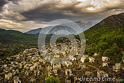 Kayakoy houses in historcial Lycian village of Kayakoy, Fethiye, Mugla, Turkey. Panoramic Ghost Town KayakÃ¶y, anciently known as Stock Photo