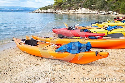 Kayaks arranged on the beach in Greece. Stock Photo