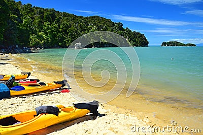 Kayaks on the beach of the Abel Tasman National Park. New Zealand, South Island Editorial Stock Photo