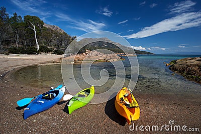 Kayaks on beach at Honeymoon Cove Stock Photo