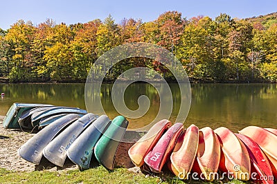 Kayaks, Canoes and Row Boats on Little Pond Editorial Stock Photo