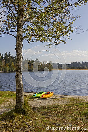 Kayaks at lake shore kirchsee Stock Photo