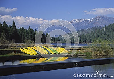 Kayaks on the shore of Hume Lake in California Stock Photo