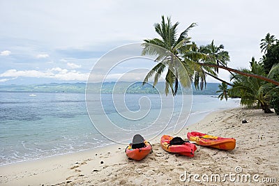 Kayaks on tropical beach Stock Photo