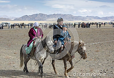 Kazakh family traveling on their horses Editorial Stock Photo