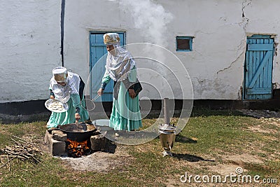 Kazakh women cooking bread, Shymkent, Kazakhstan Editorial Stock Photo
