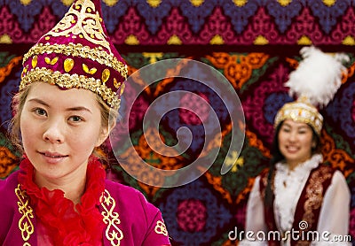 Local women and man in traditional clothes at national folkloric games in Almaty, Kazakhstan. Editorial Stock Photo