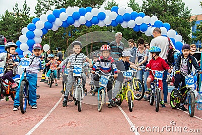 KAZAKHSTAN, ALMATY - JUNE 11, 2017: Children`s cycling competitions Tour de kids. Children aged 2 to 7 years compete in Editorial Stock Photo