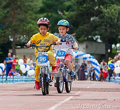 KAZAKHSTAN, ALMATY - JUNE 11, 2017: Children`s cycling competitions Tour de kids. Children aged 2 to 7 years compete in Editorial Stock Photo