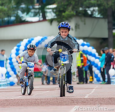 KAZAKHSTAN, ALMATY - JUNE 11, 2017: Children`s cycling competitions Tour de kids. Children aged 2 to 7 years compete in Editorial Stock Photo