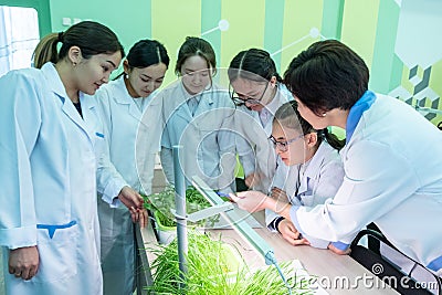 2019-09-01, Kazakhstan, Kostanay. Hydroponics. Schoolgirls and a teacher in white coats in a biology or botany class. School Editorial Stock Photo