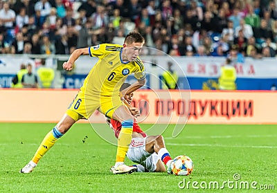 Kazakhstan national football team defender Aibol Abiken against Russia midfielder Ilzat Akhmetov Editorial Stock Photo