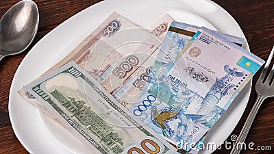 Kazakhstani tenge, dollar, and Russian ruble. Saving the budget, the subsistence minimum or the dual currency basket in Kazakhstan Stock Photo