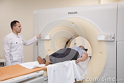 Kazan, Russia- July, 15, 2015: MRI machine and screens with doctor Editorial Stock Photo