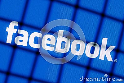 The logo of the social network Facebook behind bars. The concept of facebook censorship and prohibition Editorial Stock Photo