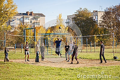 Kazatin, Ukraine - October 14, 2018: Boys play volleyball on a sunny spring day in the playground Editorial Stock Photo