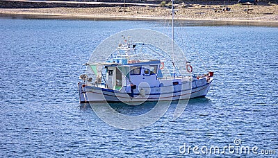 Kea, Tzia, Greece. Traditional fishing boat, trawler moored at Otzias cove Stock Photo