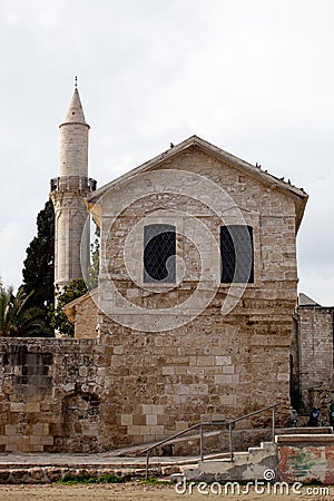 Kebir Mosquealso known as Buyuk mosque minaret in Larnaca, Cyprus and Larnaca Castle Museum Stock Photo