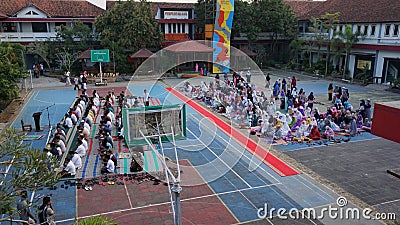 KEBUMEN, INDONESIA â€“ JULY 19, 2021: People attend the Eid al-Adha prayer at the futsal field Editorial Stock Photo
