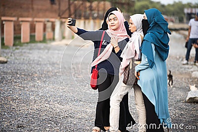 Asian hijab girl taking photo Editorial Stock Photo