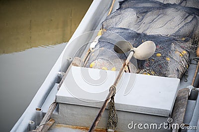 Inside boat with fishing net Stock Photo