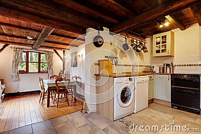 Heavily beamed ceiling in english cottage kitchen Editorial Stock Photo