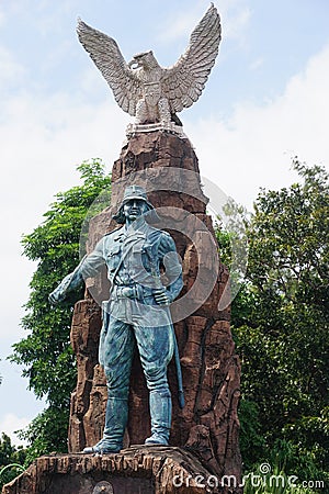 Kediri-Syu PETA monument in Kediri. The statue holding sword and keris Javanese weapon Editorial Stock Photo