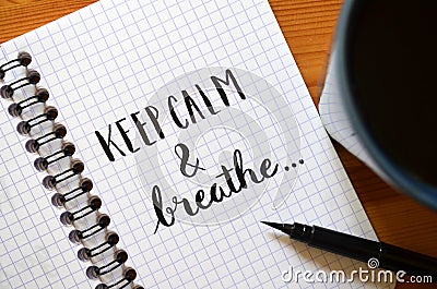 KEEP CALM AND BREATHE hand-lettered in notebook Stock Photo