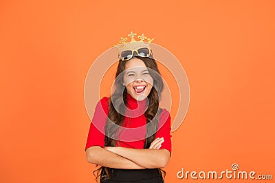 Keep celebrating. Happy girl enjoy celebrating orange background. Little child wear prop crowm and glasses. Celebrating Stock Photo