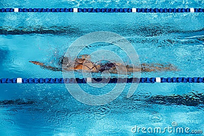 Keep fit through swimming laps in swimming pool Stock Photo