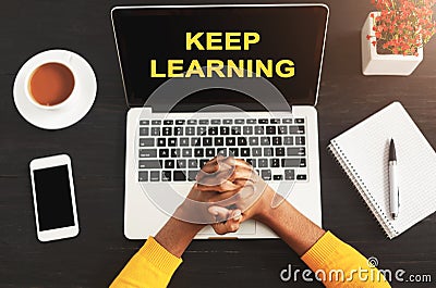 Keep Learning Text On Laptop Screen Standing On Student`s Table Stock Photo