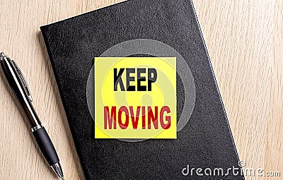 KEEP MOVING text on white paper. the inscription on the notebook Stock Photo