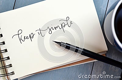 KEEP IT SIMPLE hand-lettered in notepad Stock Photo