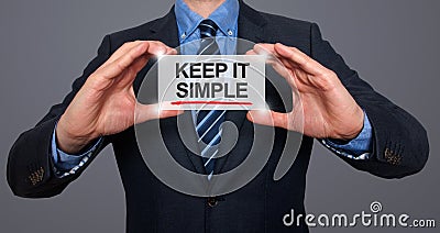 Keep It Simple on a virtual screen with a businessman holding Stock Photo