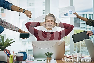 Keep it together and get it done. a young businessman looking calm in a demanding office environment. Stock Photo