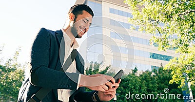 Keeping you connected on every business trip. a handsome young businessman using his cellphone while commuting to work Stock Photo