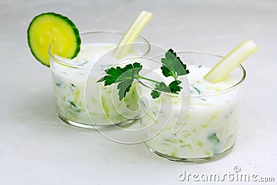 Kefir, ayran, yoghurt with vegetables and greens in glasses Stock Photo